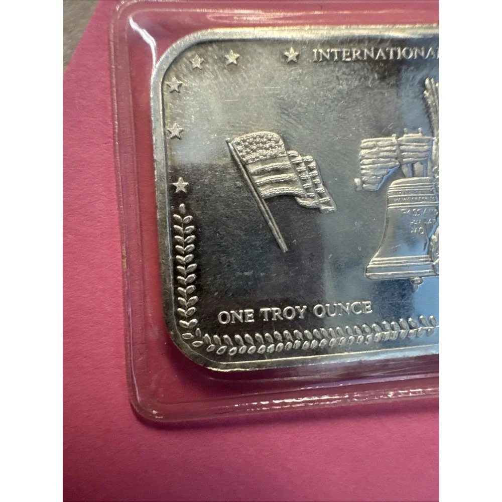 INTERNATIONAL TRADE UNIT LIBERTY BELL FLAGS EAGLE 1 TROY OZ .999 FINE SILVER BAR